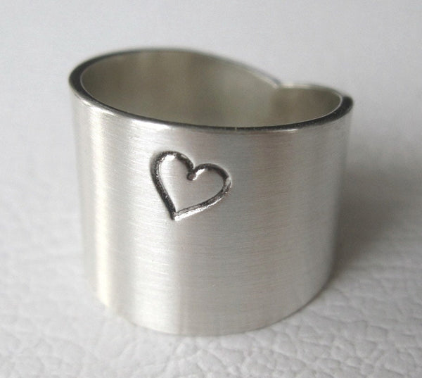 wide ring with heart engraved in sterling silver